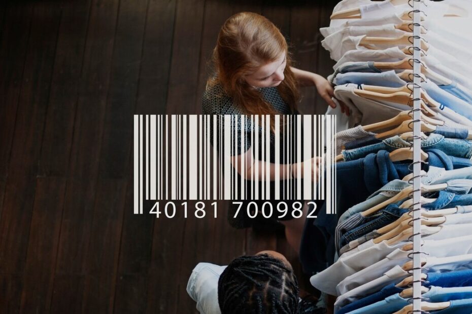 A top-down view of two people browsing through a clothing rack filled with neatly arranged shirts and jeans. The image prominently features a large barcode overlaying the scene, with the numbers "40181 700982" displayed beneath it. The wooden floor and organized display suggest a retail environment, highlighting the connection between product barcodes and inventory management in stores.